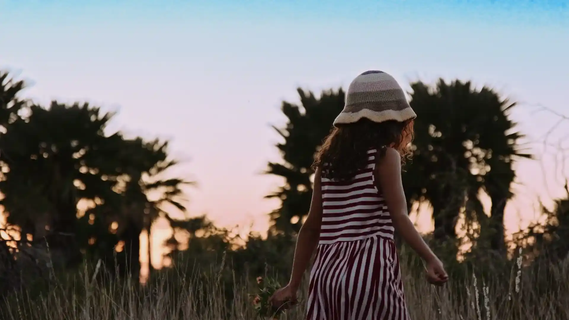 Girl walking through flowers at Altos del Palmar